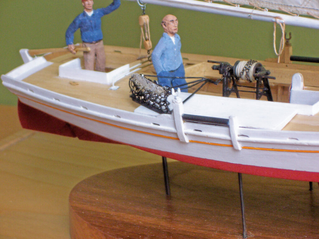 Model of Chesapeake Bay Skipjack 'Shorebird' - Figures at tiller and dredge