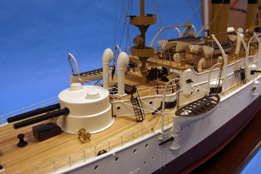 Model of USS Olympia (C-6) - Aft turret and boat deck, starboard quarter, low angle