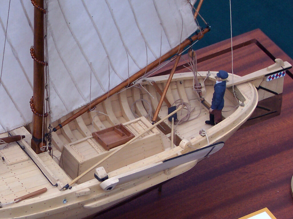 Model of a Dutch botter - view of live-well and captain at the tiller